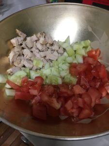 Cut up veggies for your pasta chicken cucumber salad